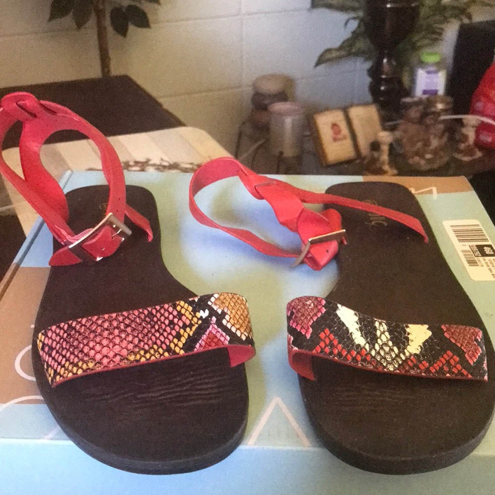 Red/black sandals that fasten around the ankles..worn once reptile print on band